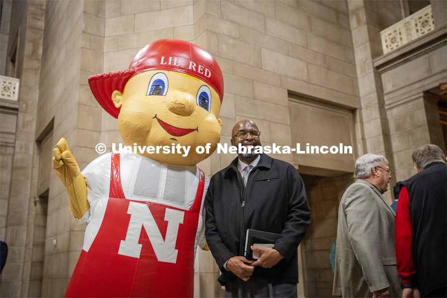 Chancellor Rodney Bennett poses with Lil Red for a picture at the I love NU event in the Nebraska State Capitol. March 6, 2024. Photo by Kristen Labadie / University Communication.